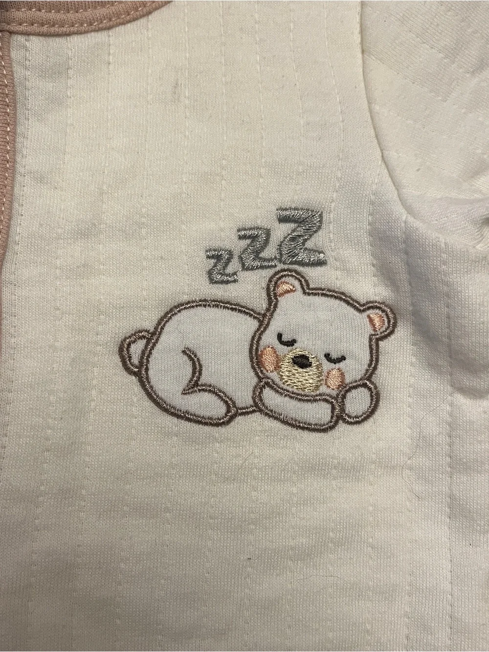 Cream Baby Footed One-Piece with Beige Trim and Sleeping Bear